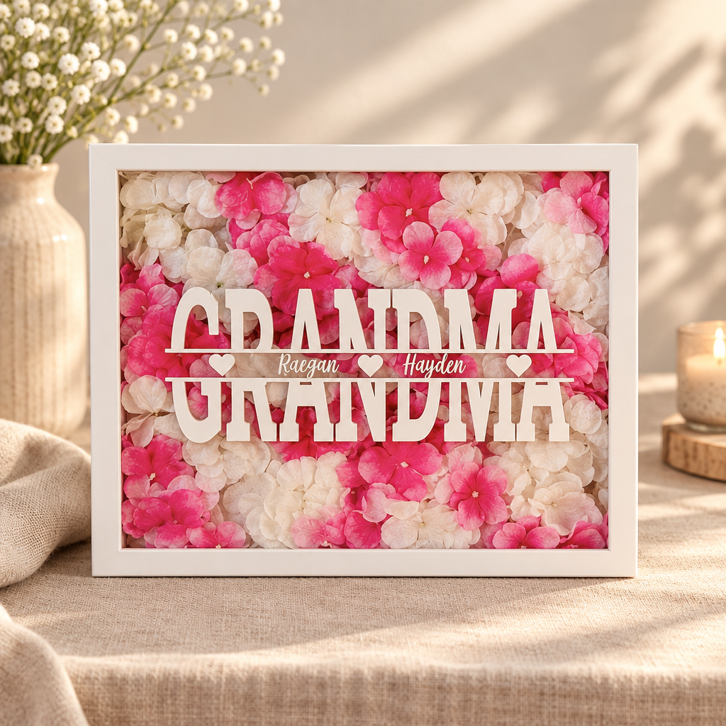 Personalized floral shadowbox with soft pink and white petals and custom name overlay